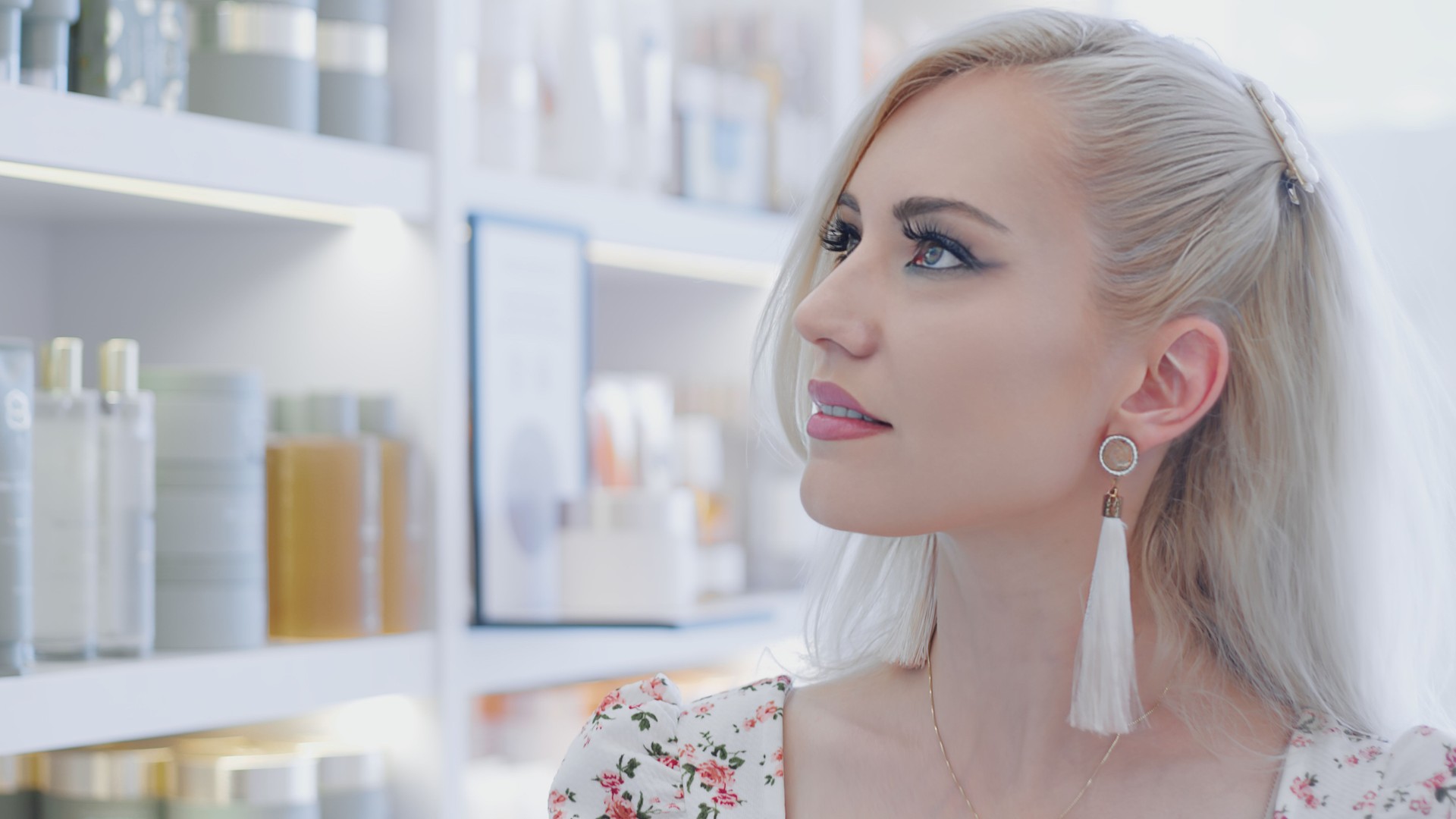 Woman looking at beauty products on store shelves